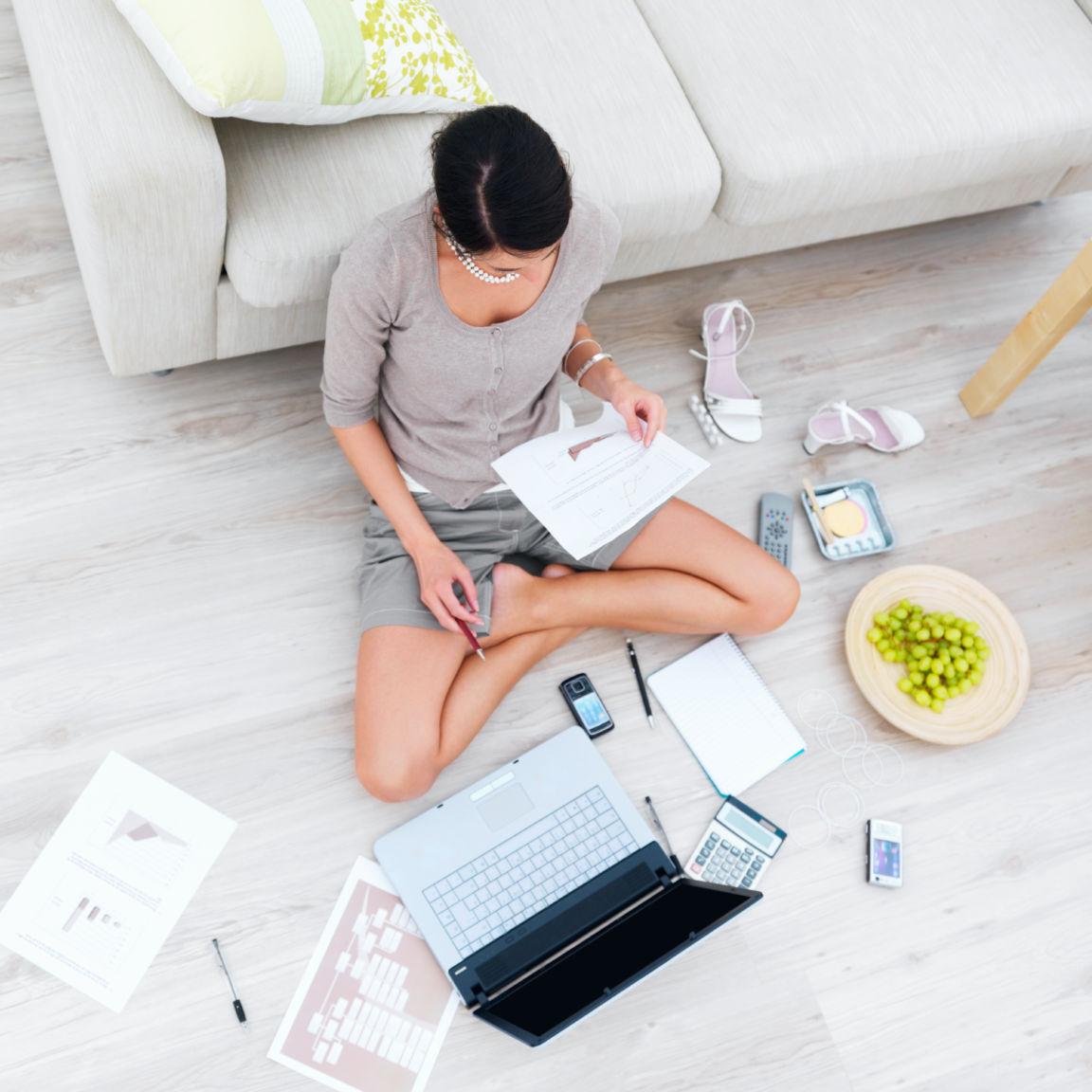 Business woman sitting in house with laptopbeside sofa 146789166 6208x5405