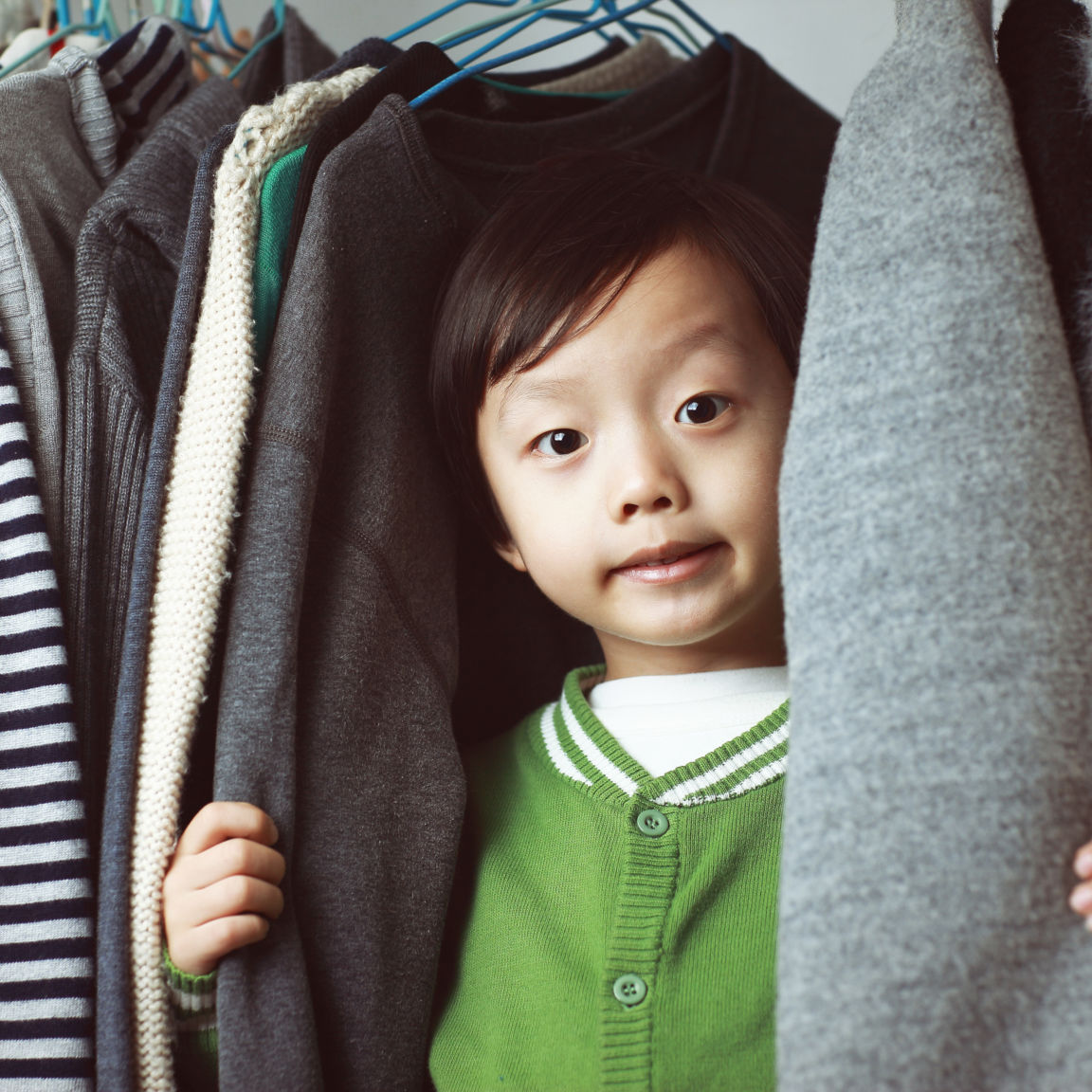 Child playing in the closet 529073338 3869x2579