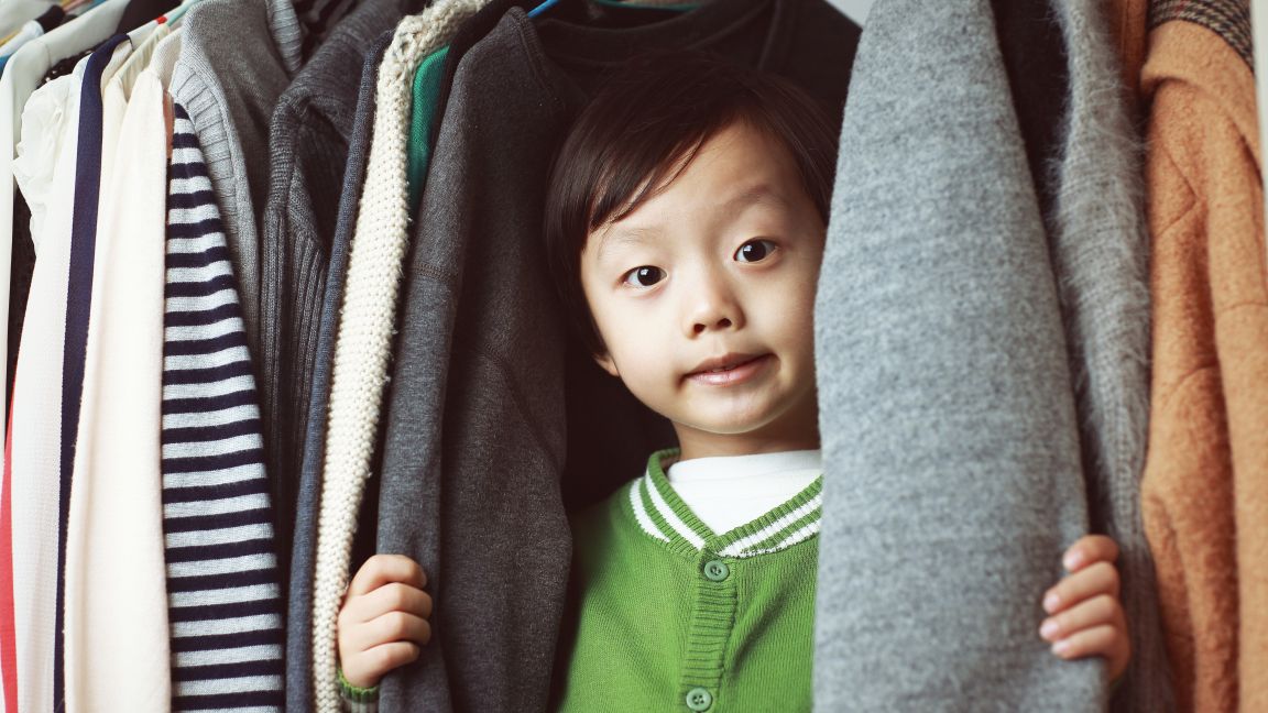 Child playing in the closet 529073338 3869x2579